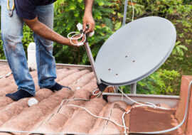 worker installing satellite dish and antenna on ro 2021 08 30 18 49 38 utc scaled